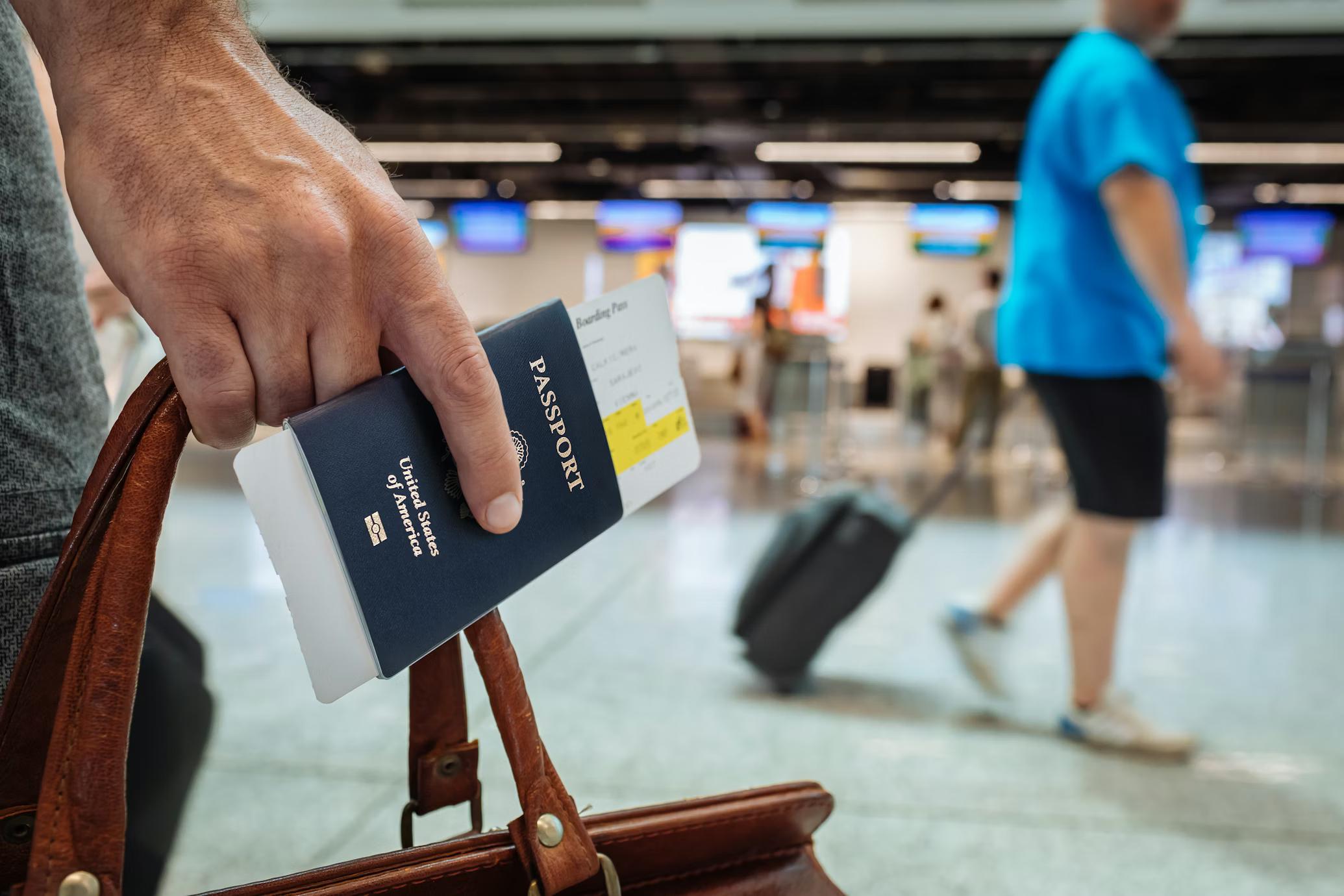A Man Holding Passport and Onward Ticket For Immigration at Airport