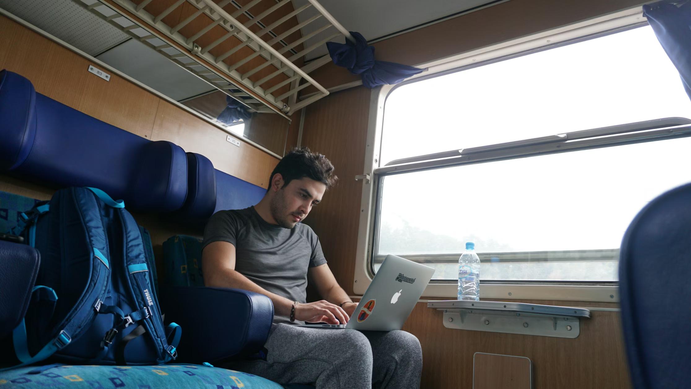 A digital nomad traveller searching on laptop for dummy tickets